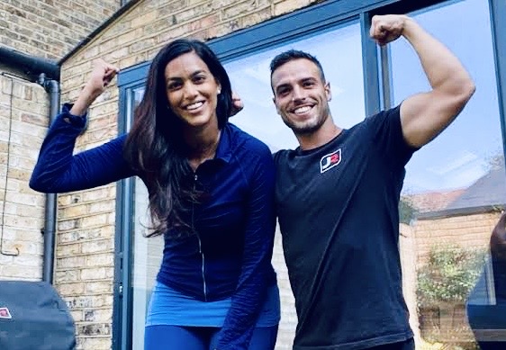 Mobile personal trainer in Battersea training client at home during personal training session